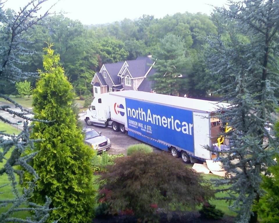 Moving truck being unloaded after a long distance move Public Domain, https://en.wikipedia.org