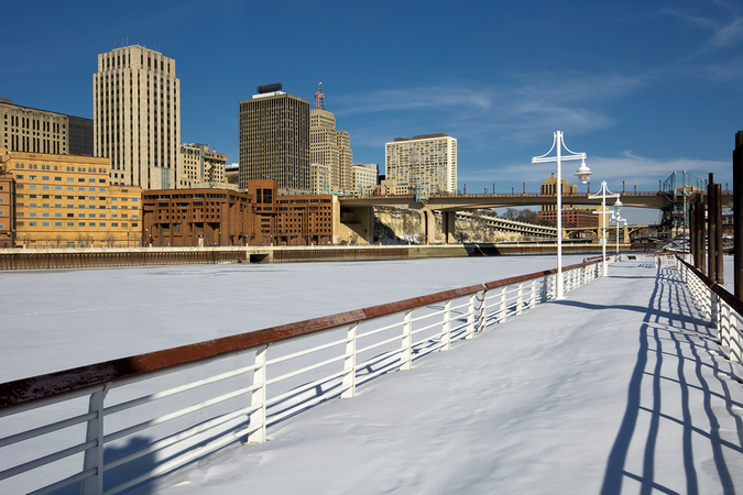 St Paul winter – snow and ice covered Mississippi River with downtown view